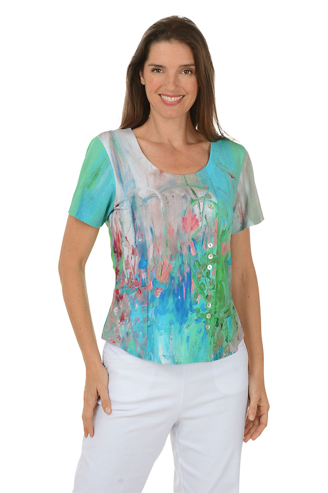 Woman wearing a colorful top with abstract design on a white background.