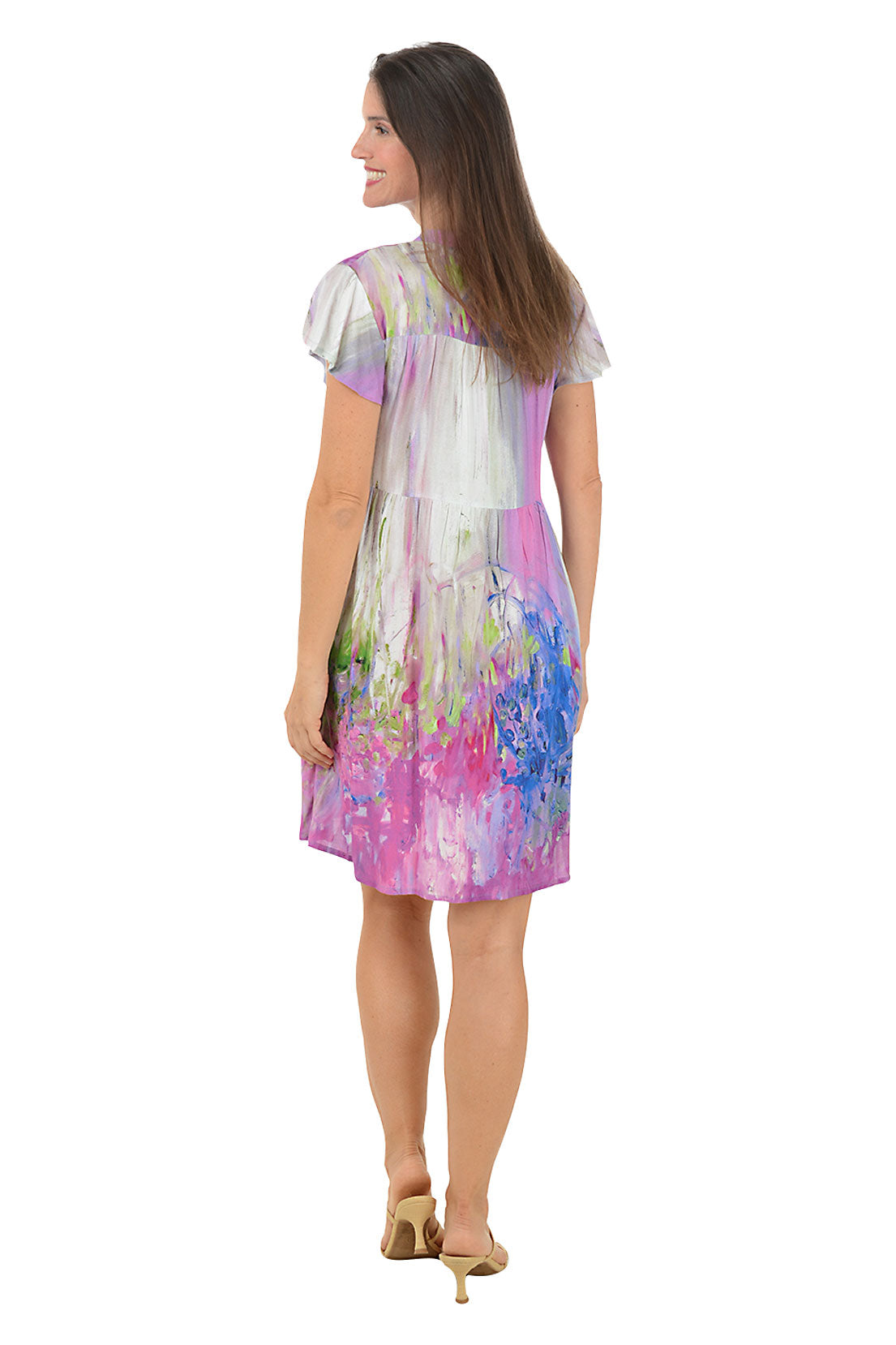 Woman wearing a colorful dress with a white background