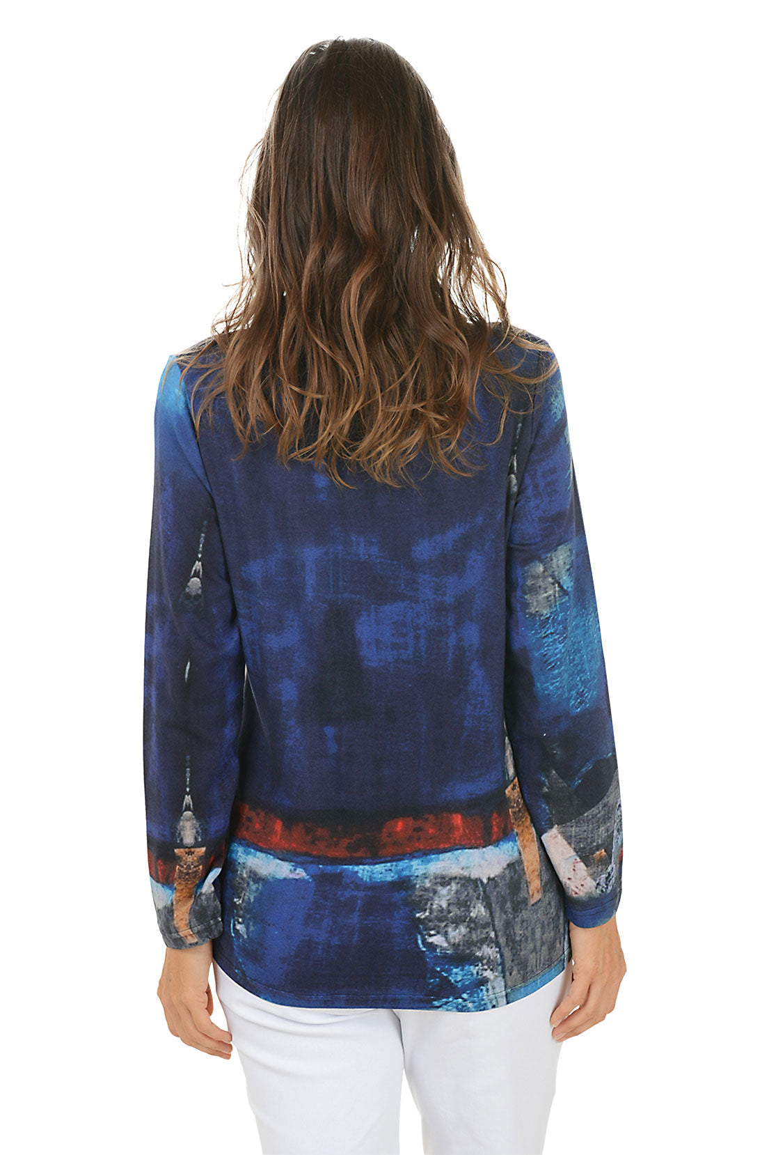 Woman wearing a colorful long-sleeve top with abstract design on a white background. Back shot.