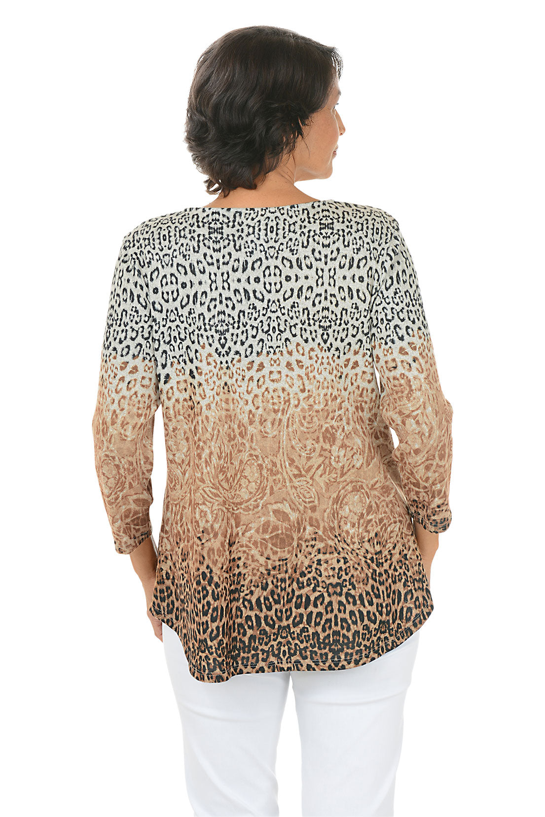 Woman wearing a tan 3/4 sleeve leopard print top and white pants on a white background. Back shot.