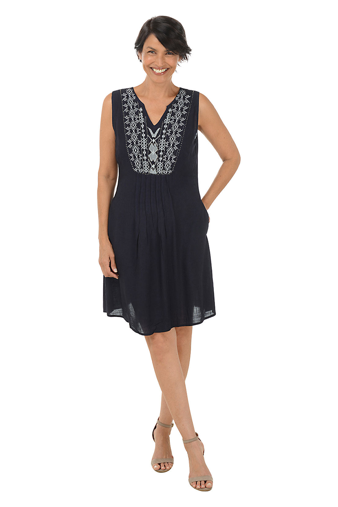 Woman wearing a sleeveless navy dress