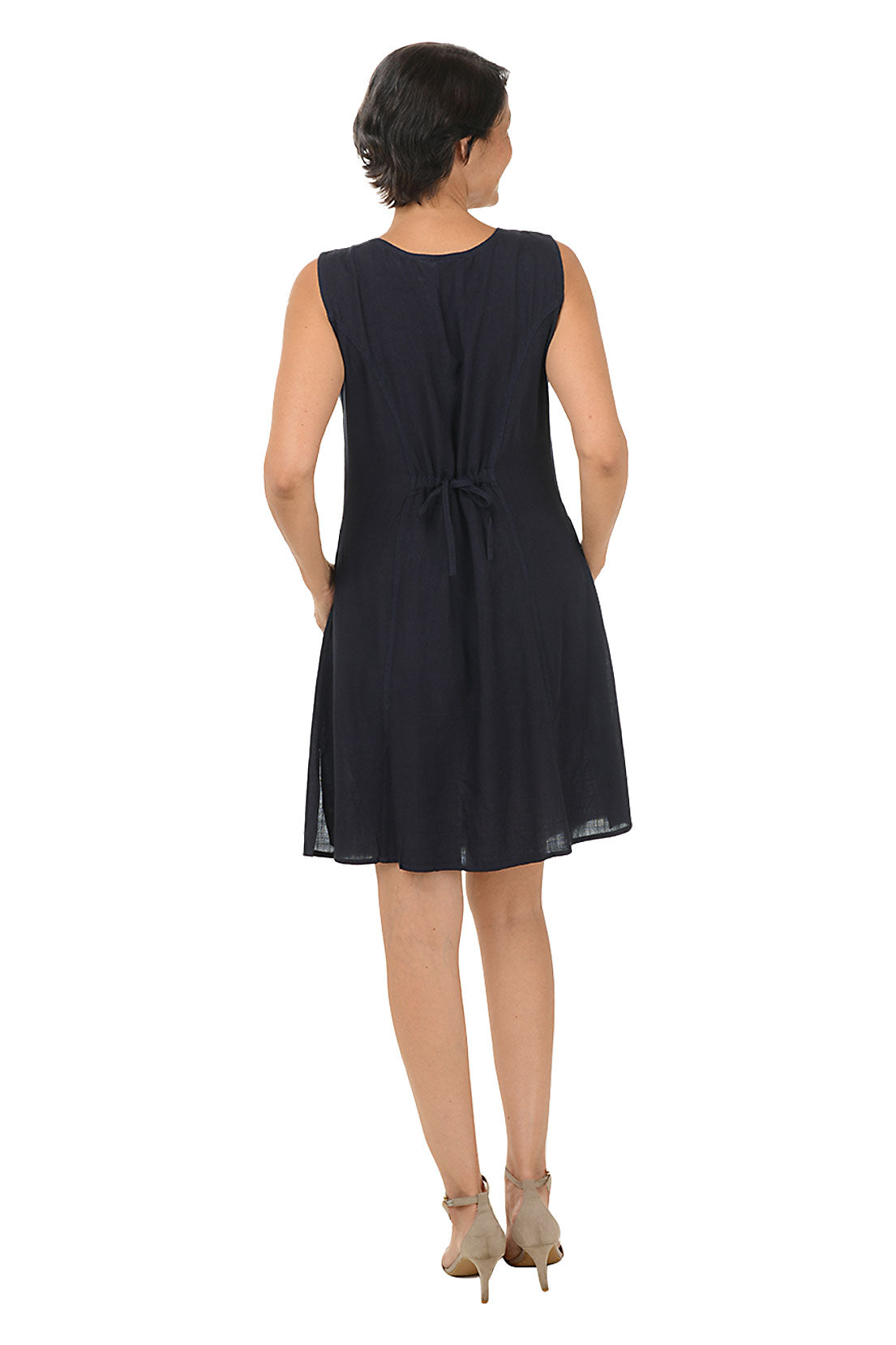 Woman wearing a sleeveless navy dress