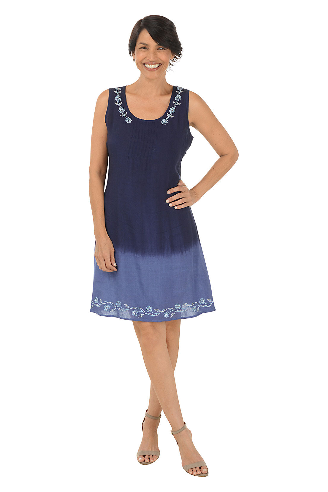 Woman wearing a sleeveless navy dress