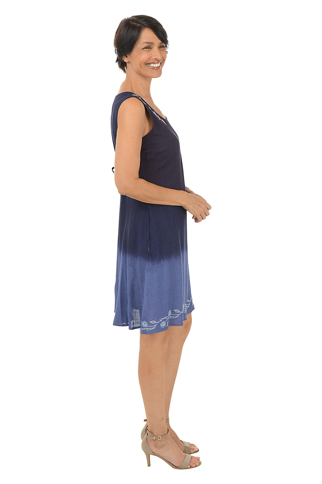 Woman wearing a sleeveless navy dress