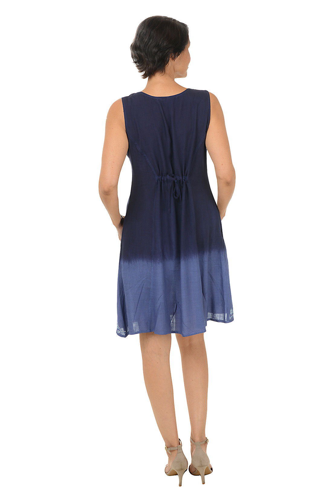 Woman wearing a sleeveless navy dress