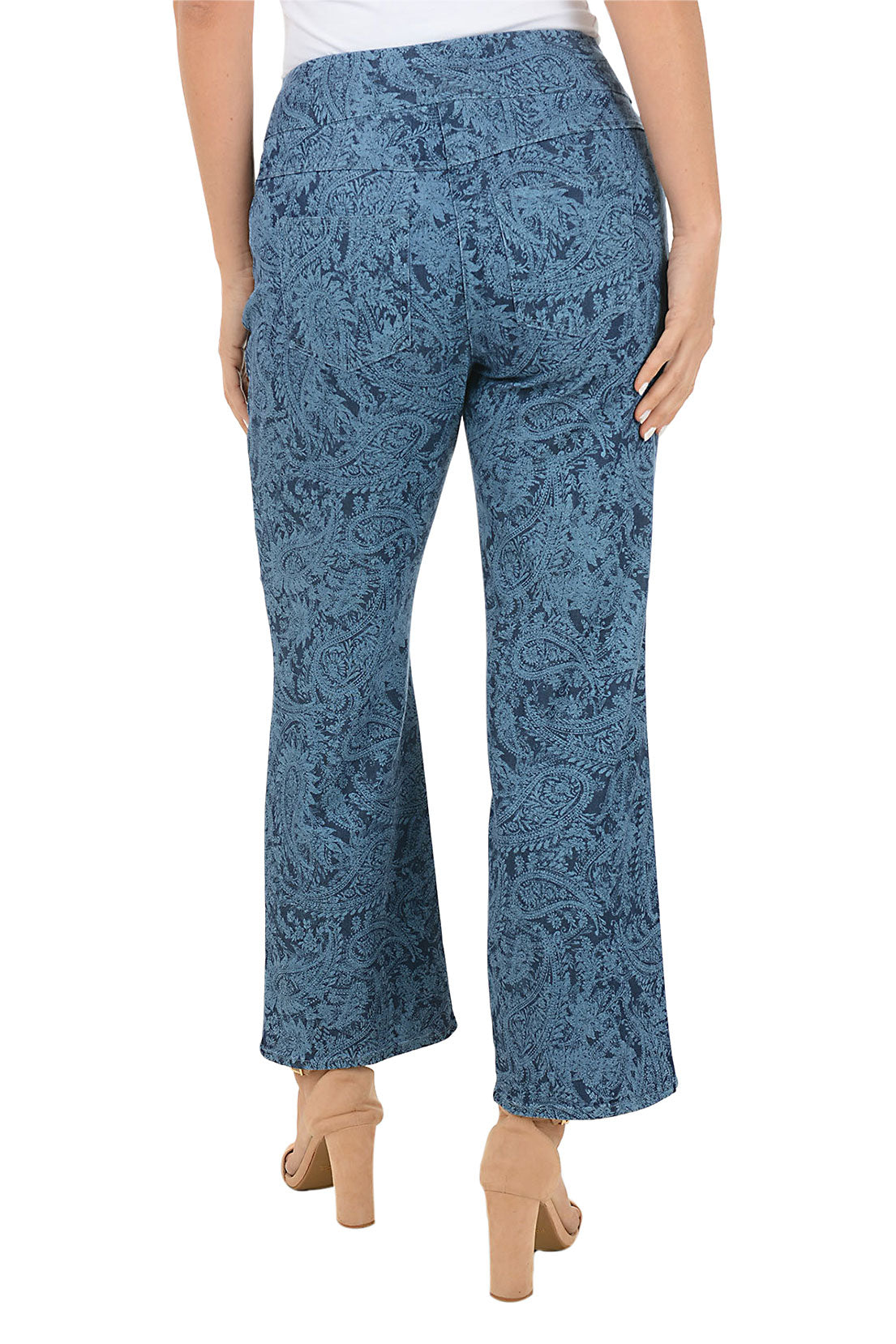 Blue denim paisley patterned ankle pants worn by a person on a white background. Back shot.