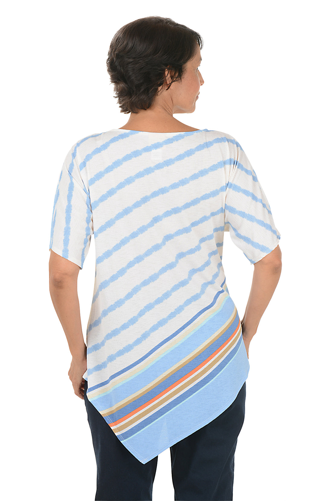 A back shot of a model wearing a blue sky colorful striped shirt with floral patterns on a white background