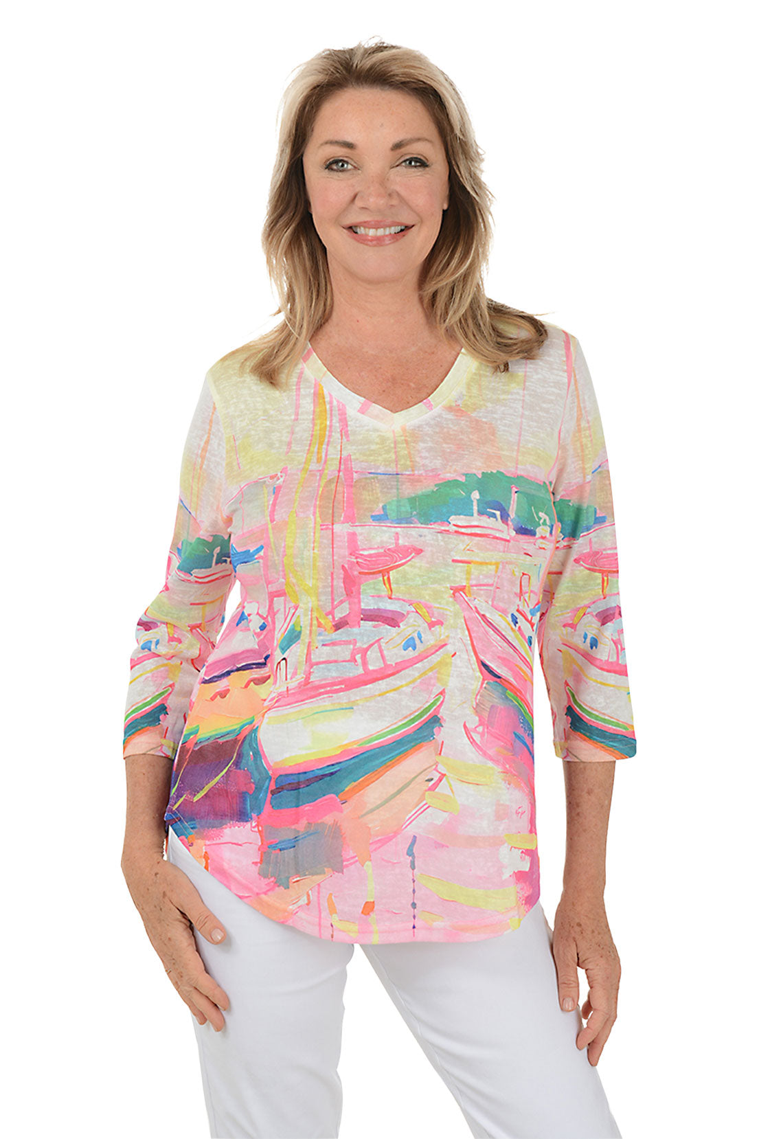A woman wearing a multi-colored 3/4 sleeve v-neck top with a boat watercolor pattern.