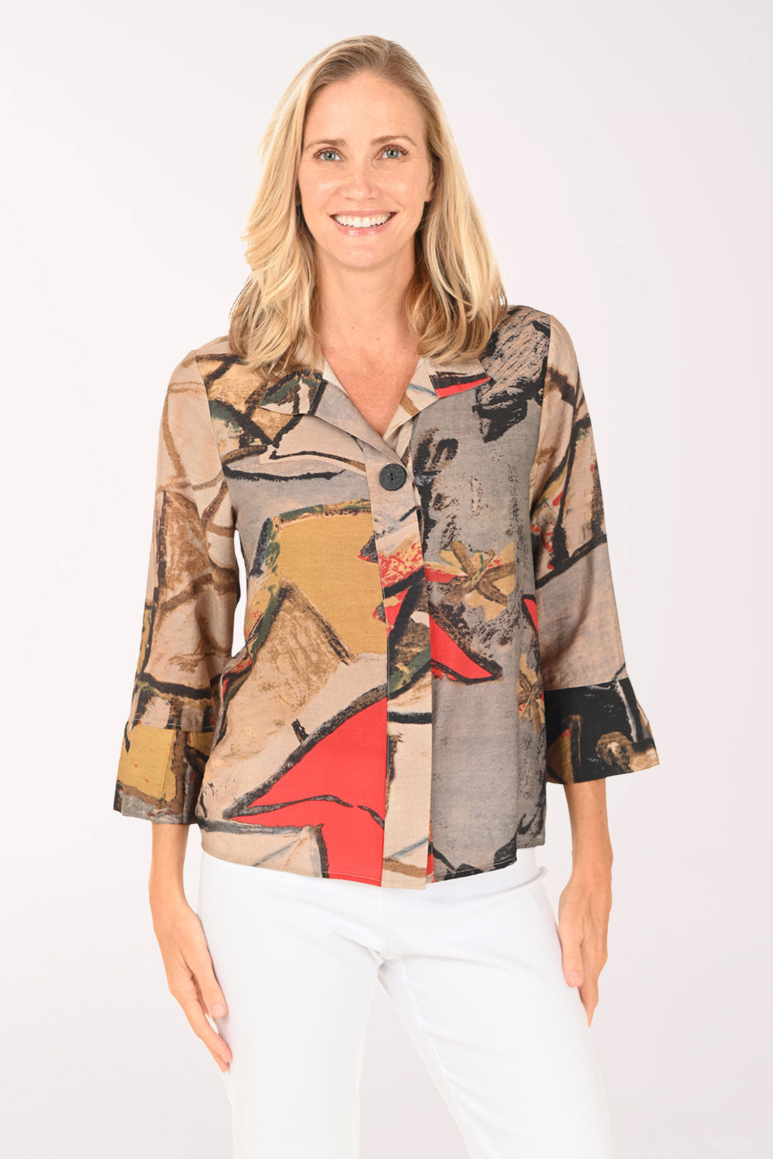 Woman wearing a colorful patterned shirt on a white background