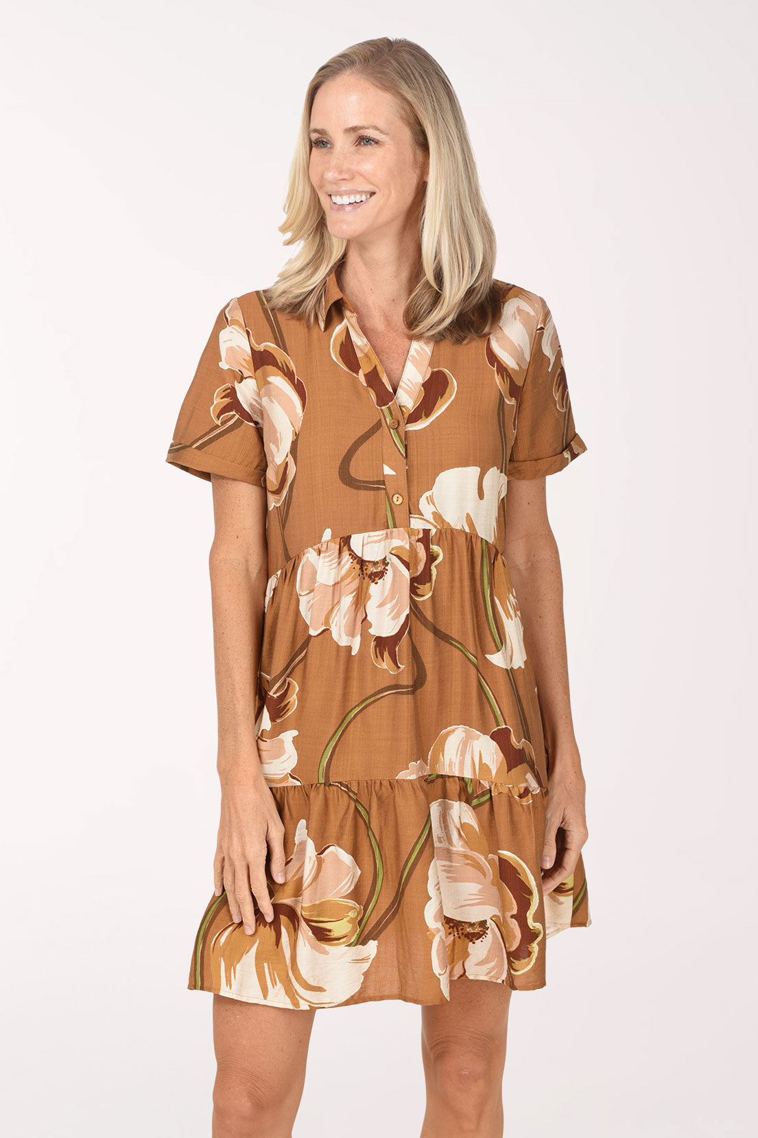 Close-up of the cuffed short sleeve and floral print on the Cocoa Floral Tiered Short Sleeve Dress