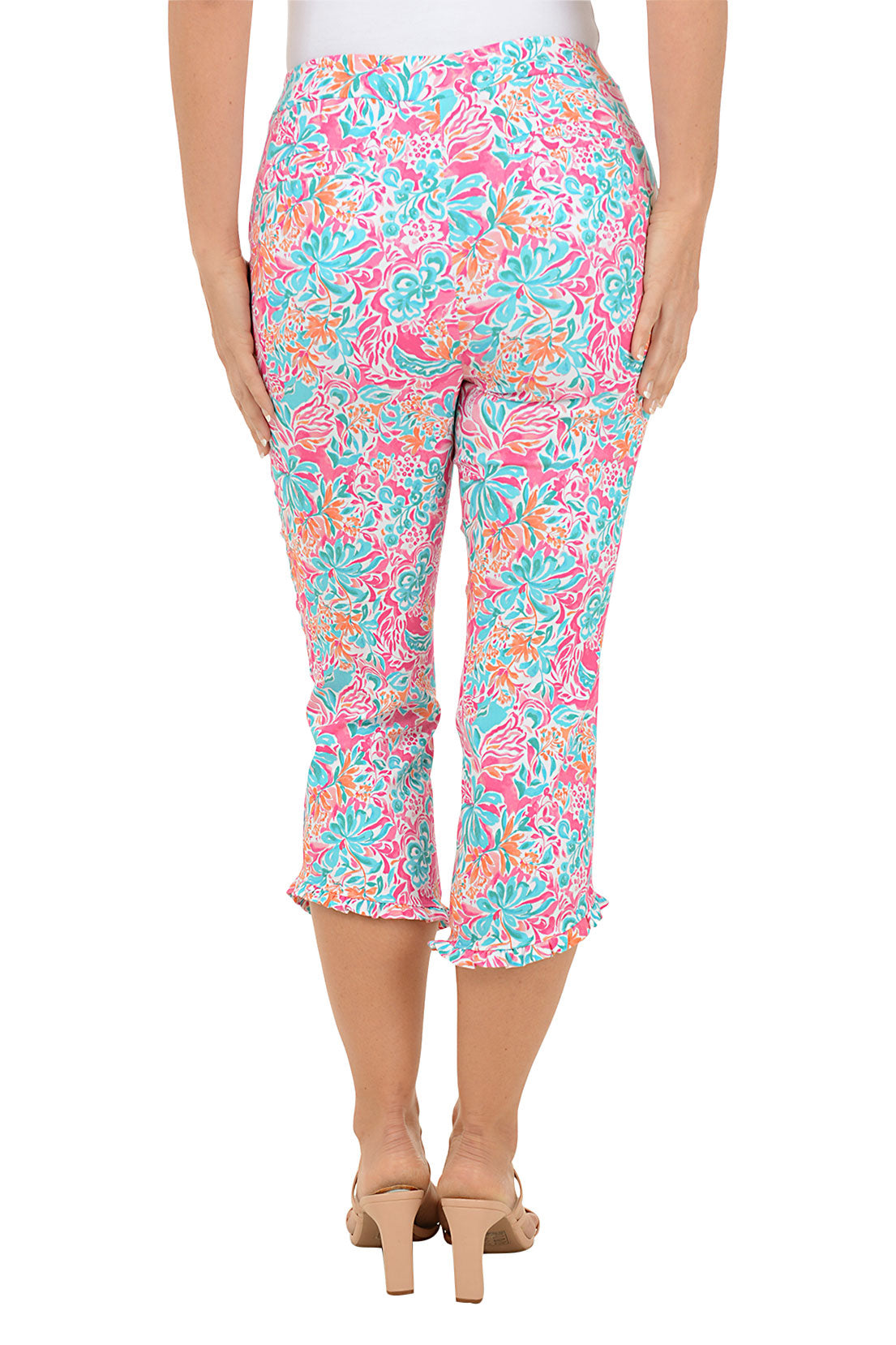Colorful patterned pants worn by a person on a white background. Back shot.