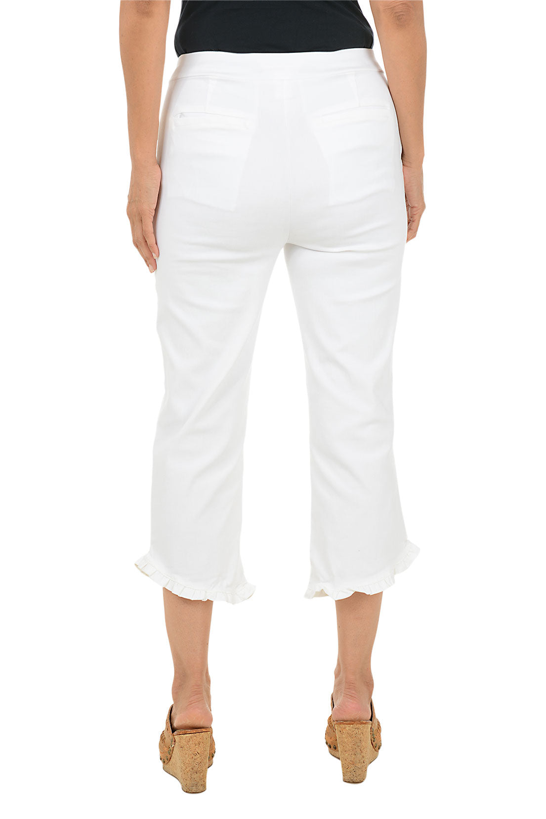 Person wearing white cropped pants on a white background. Back shot.