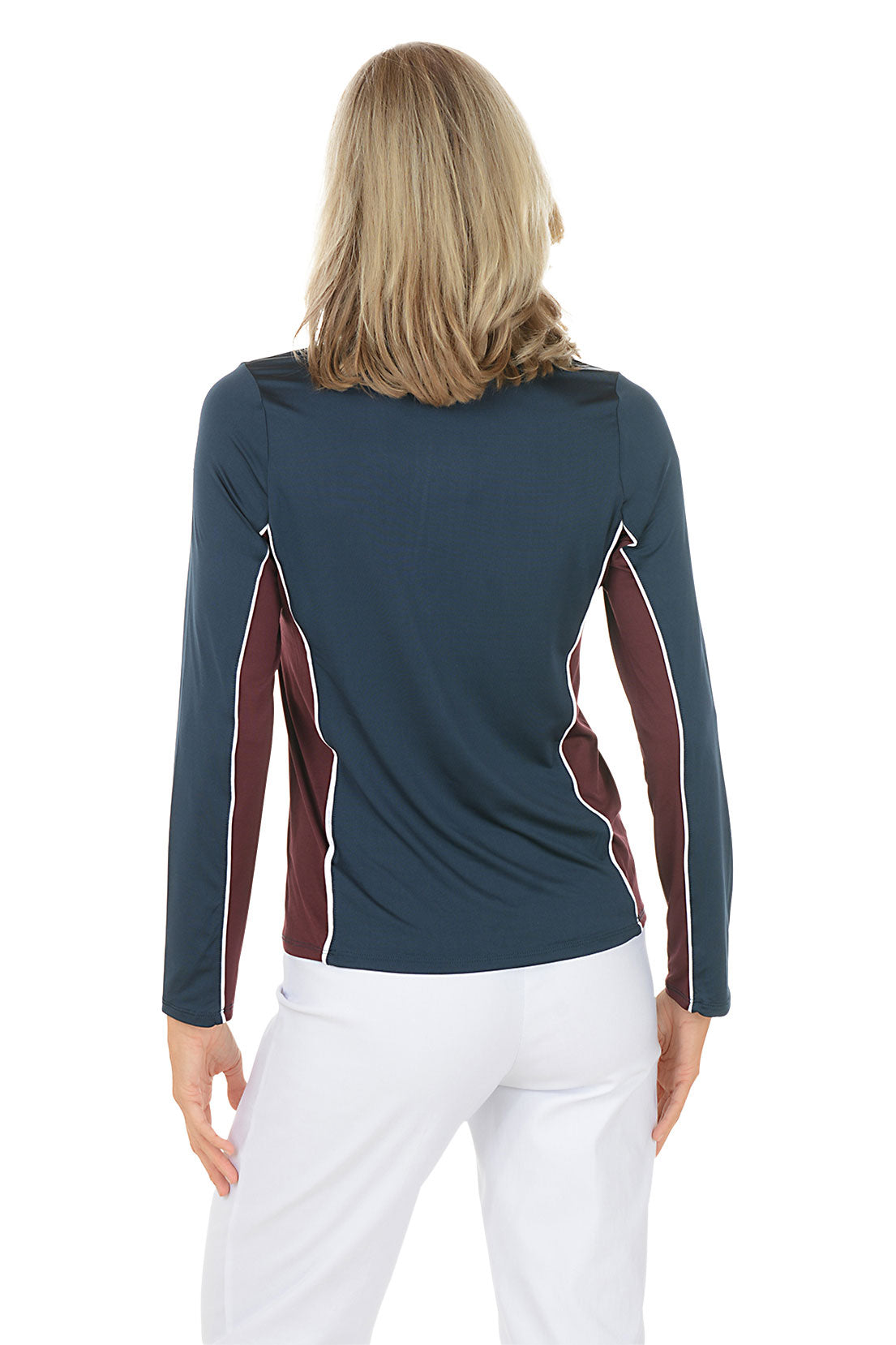 A woman wearing a navy long sleeve activewear top with a maroon color detail under the arm. Back shot.