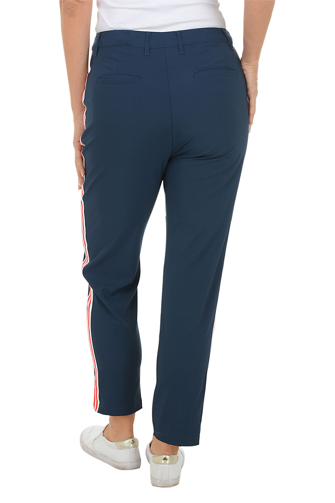 Navy pants worn by a person on a white background. Back shot.