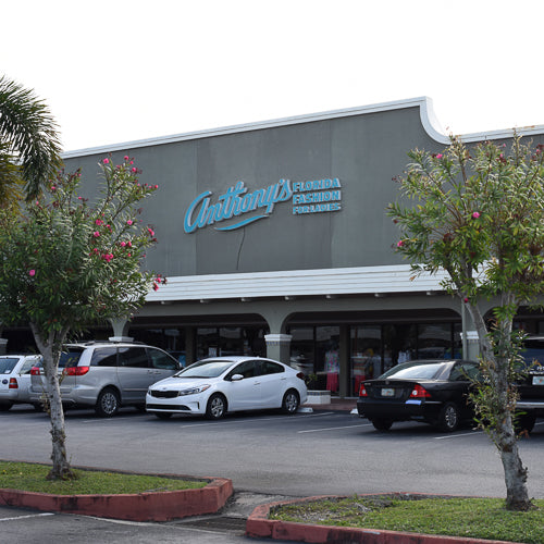 Picture of the front of an Anthony's Ladies Apparel store with parking lot in Stuart.