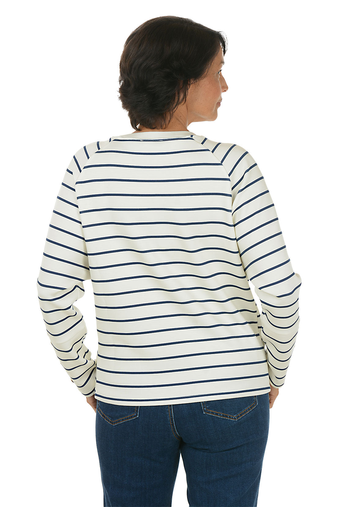 Woman wearing a white and navy striped crew neck sweater. Back shot.