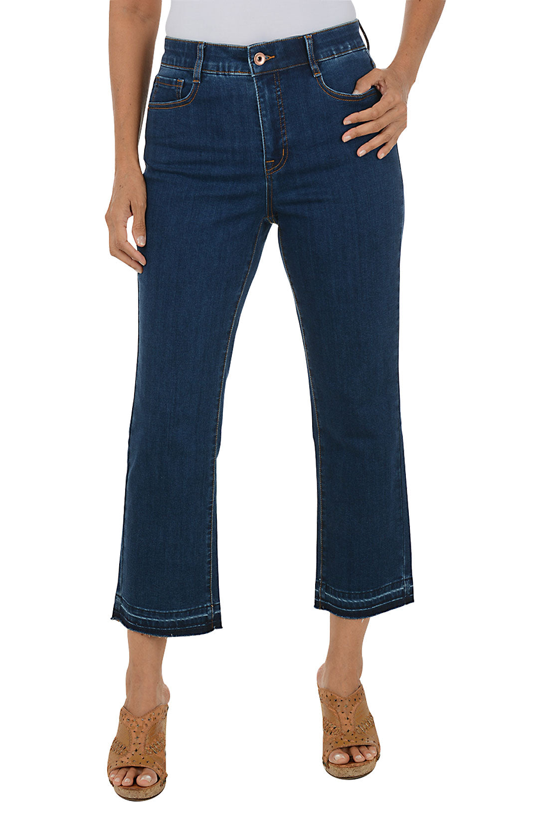 Person wearing dark blue jeans on a white background