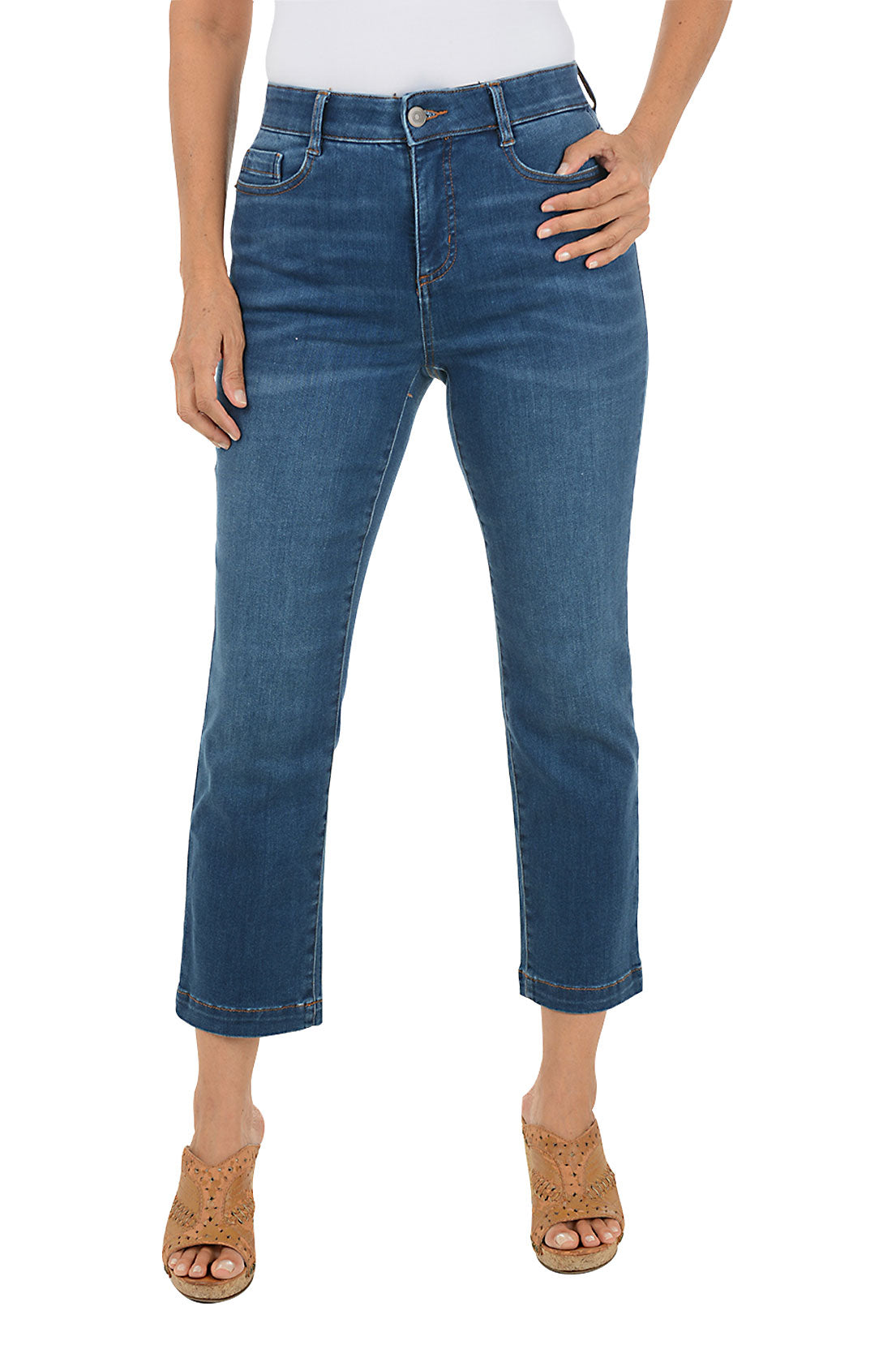 Person wearing blue jeans on a white background.
