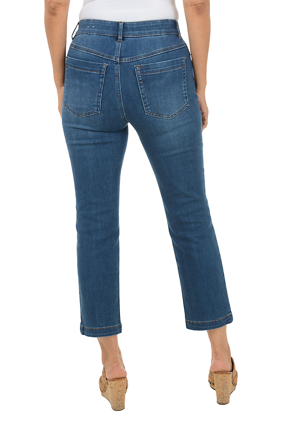Person wearing blue jeans on a white background. Back shot.