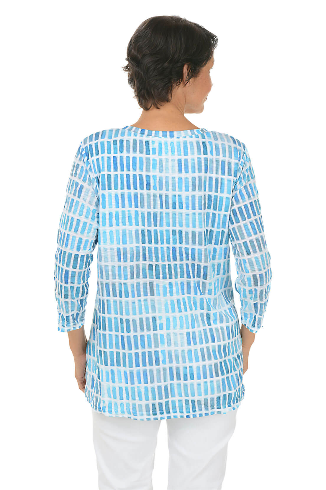 Woman wearing a blue patterned shirt on a white background