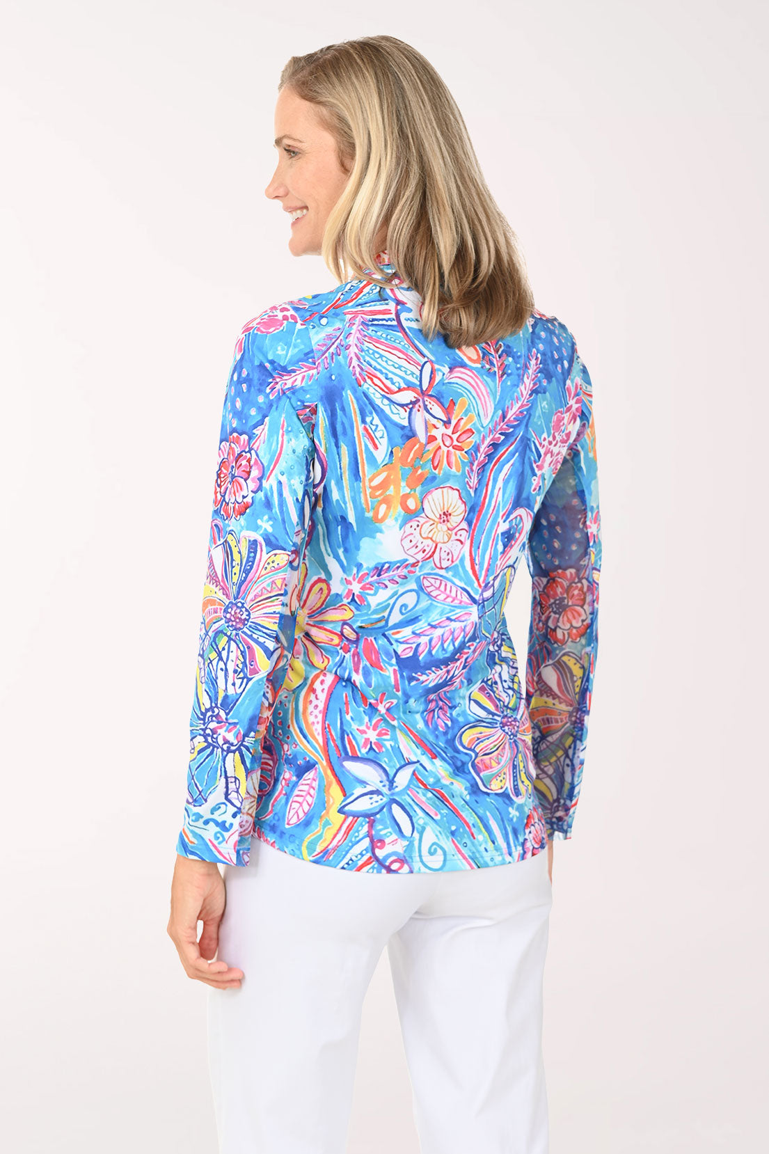 Woman wearing a multi floral quarter zip-up top