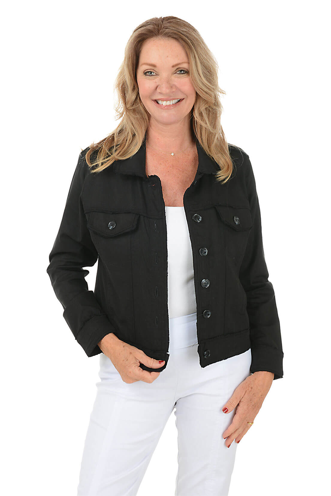 Woman wearing a black jacket over a white top and pants on a white background