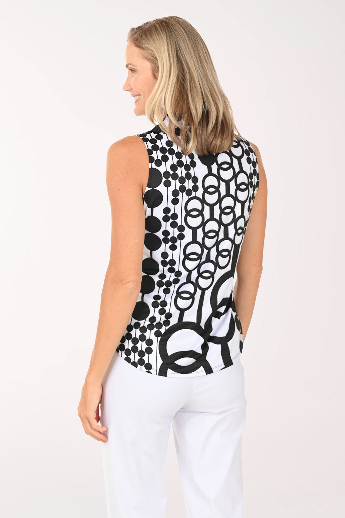 Woman wearing a black and white abstract sleeveless top