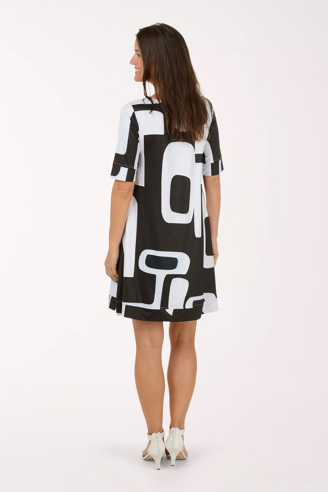 Tango Mango Modern Shapes UPF50 Elbow Sleeve Dress, back view, bold black and white geometric shapes