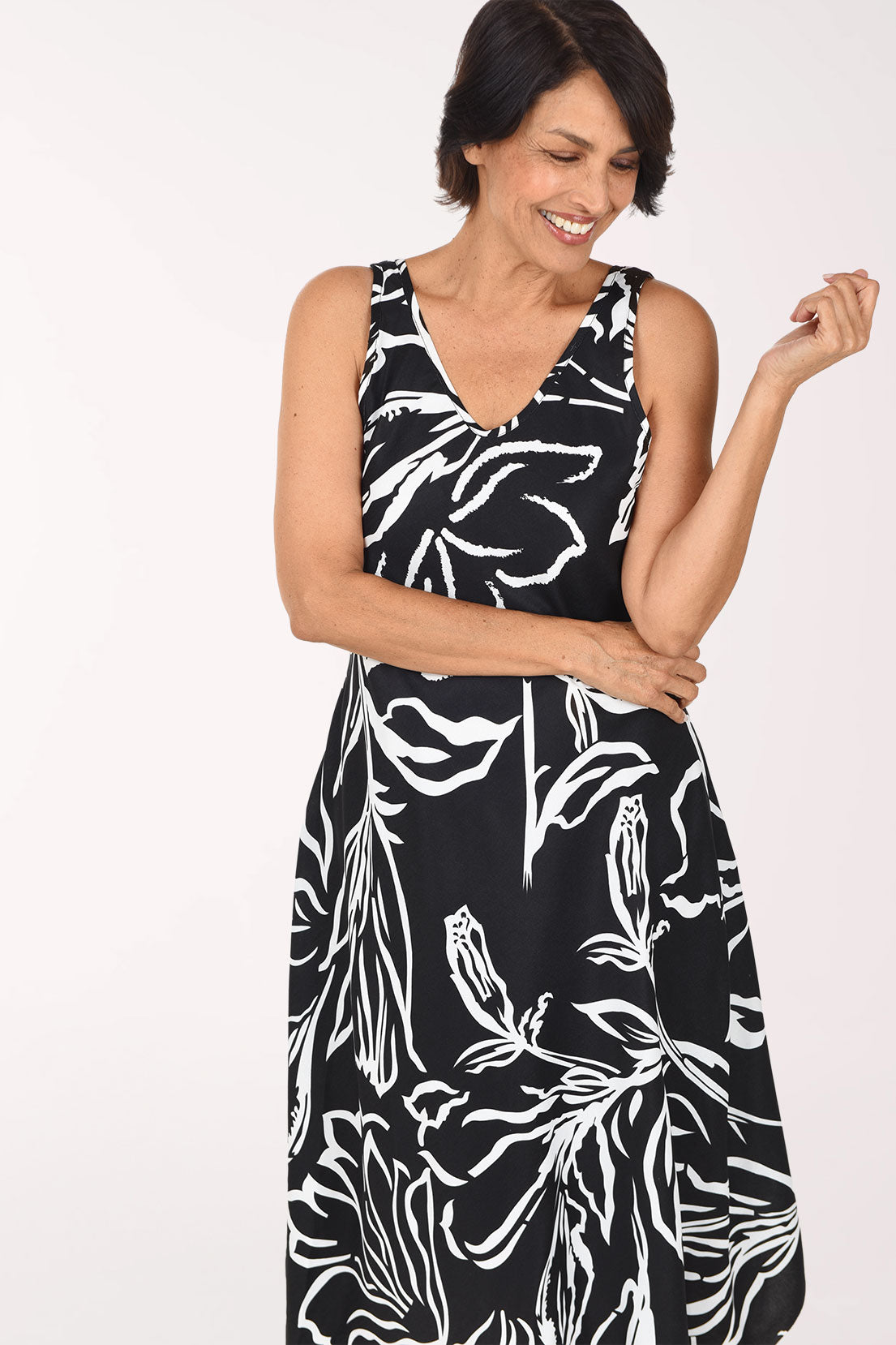 Tango Mango Zebra Flowers Sleeveless Midi Dress, close-up front view, white line-drawn flowers and leaves on black