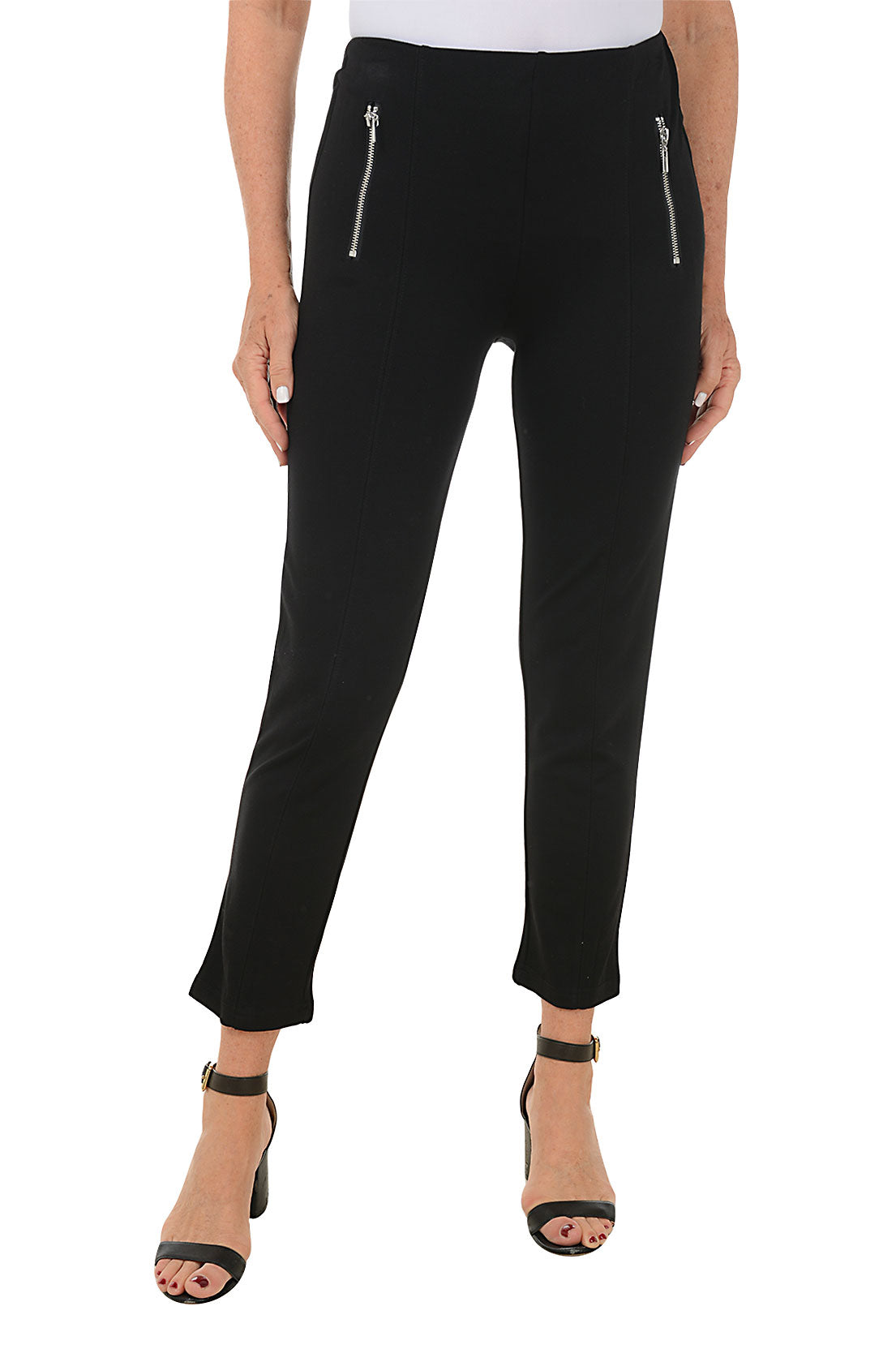 A front shot of a model wearing a pair of black leggings with front faux zip pockets, displayed on a model without visible footwear.