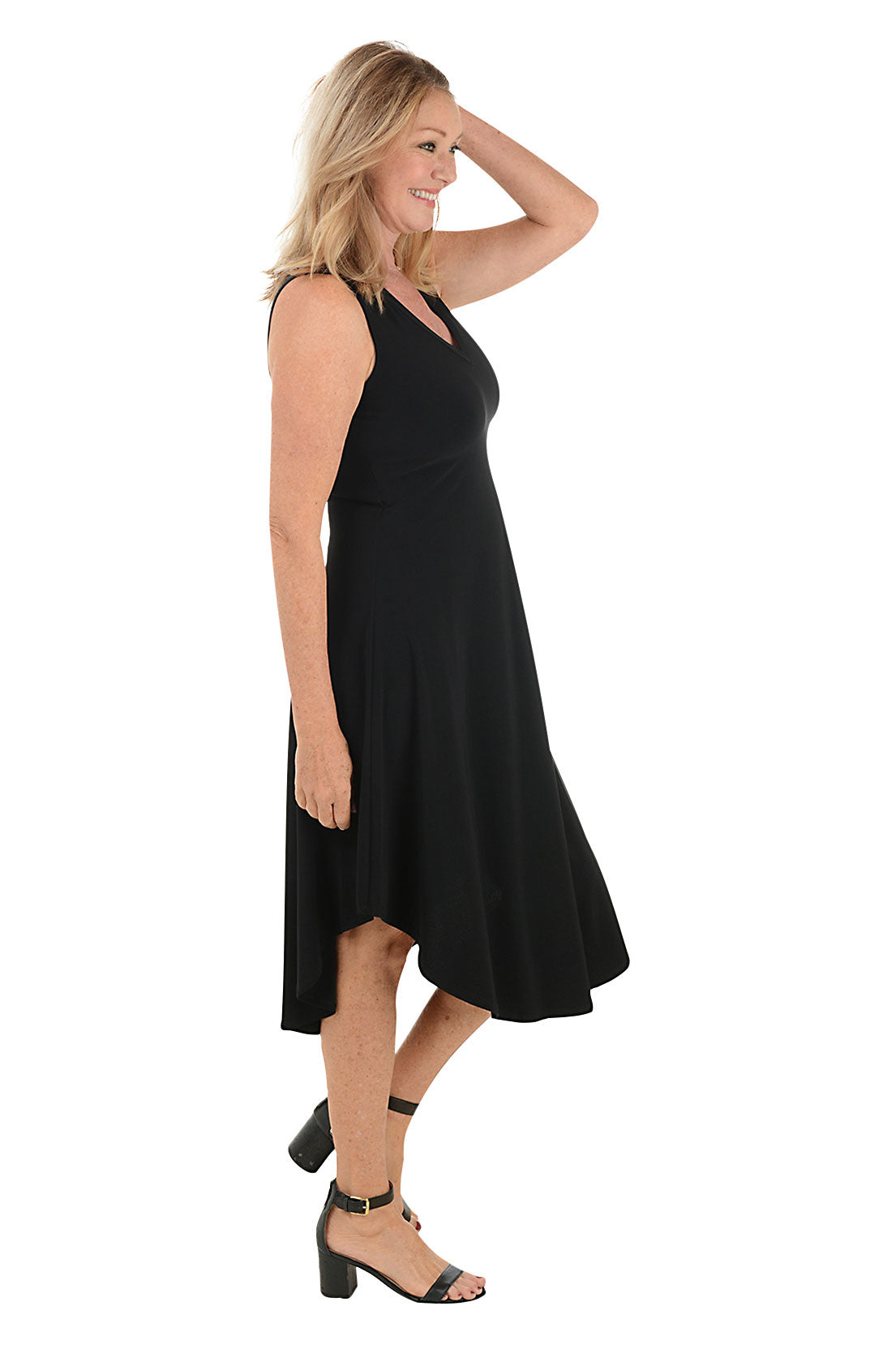 Woman wearing a black sleeveless dress on a white background