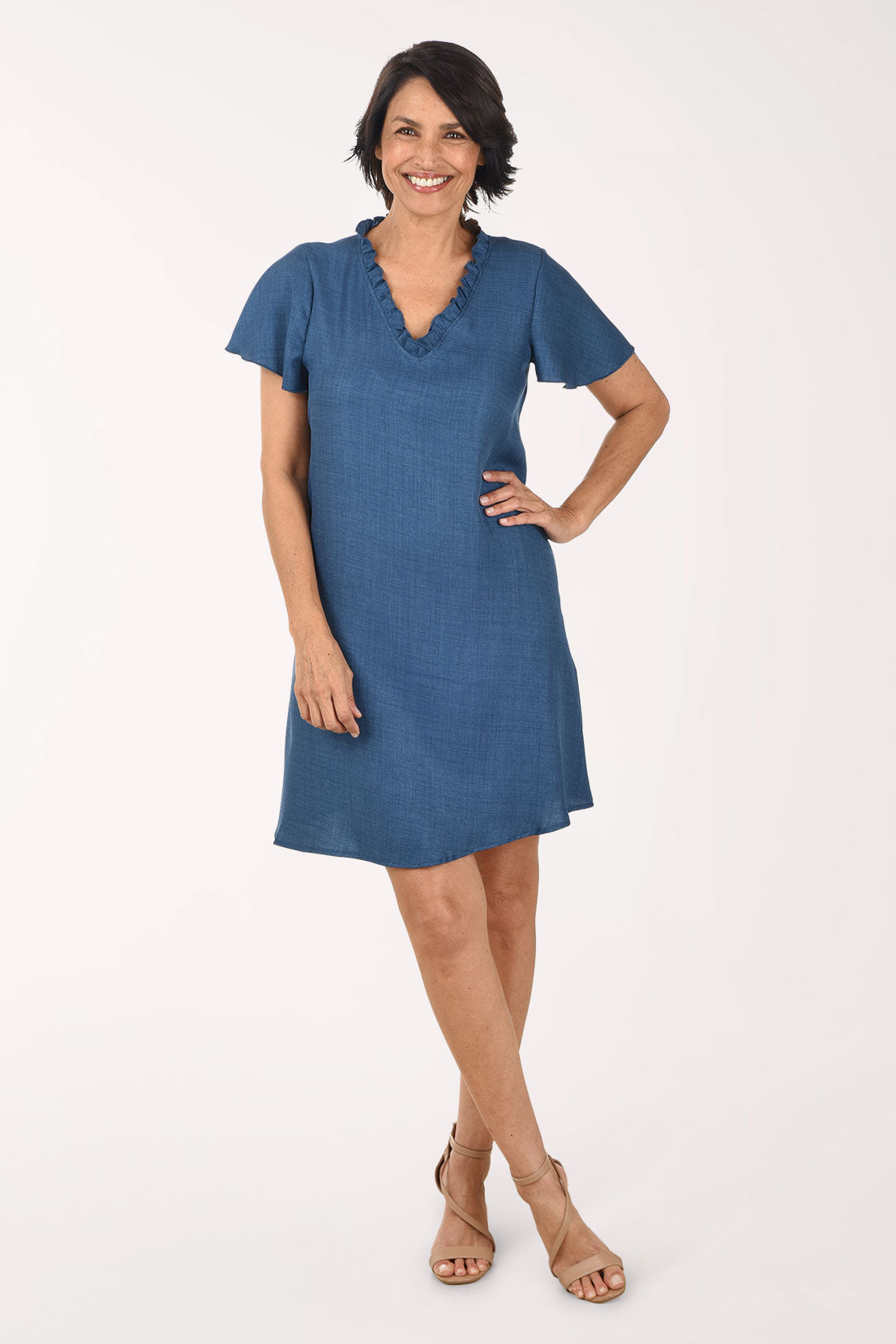 Woman wearing a blue dress on a white background
