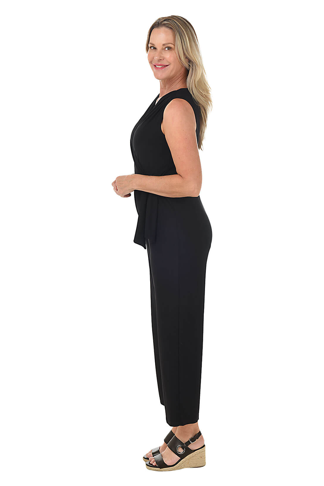 Side photo of model in black jumpsuit