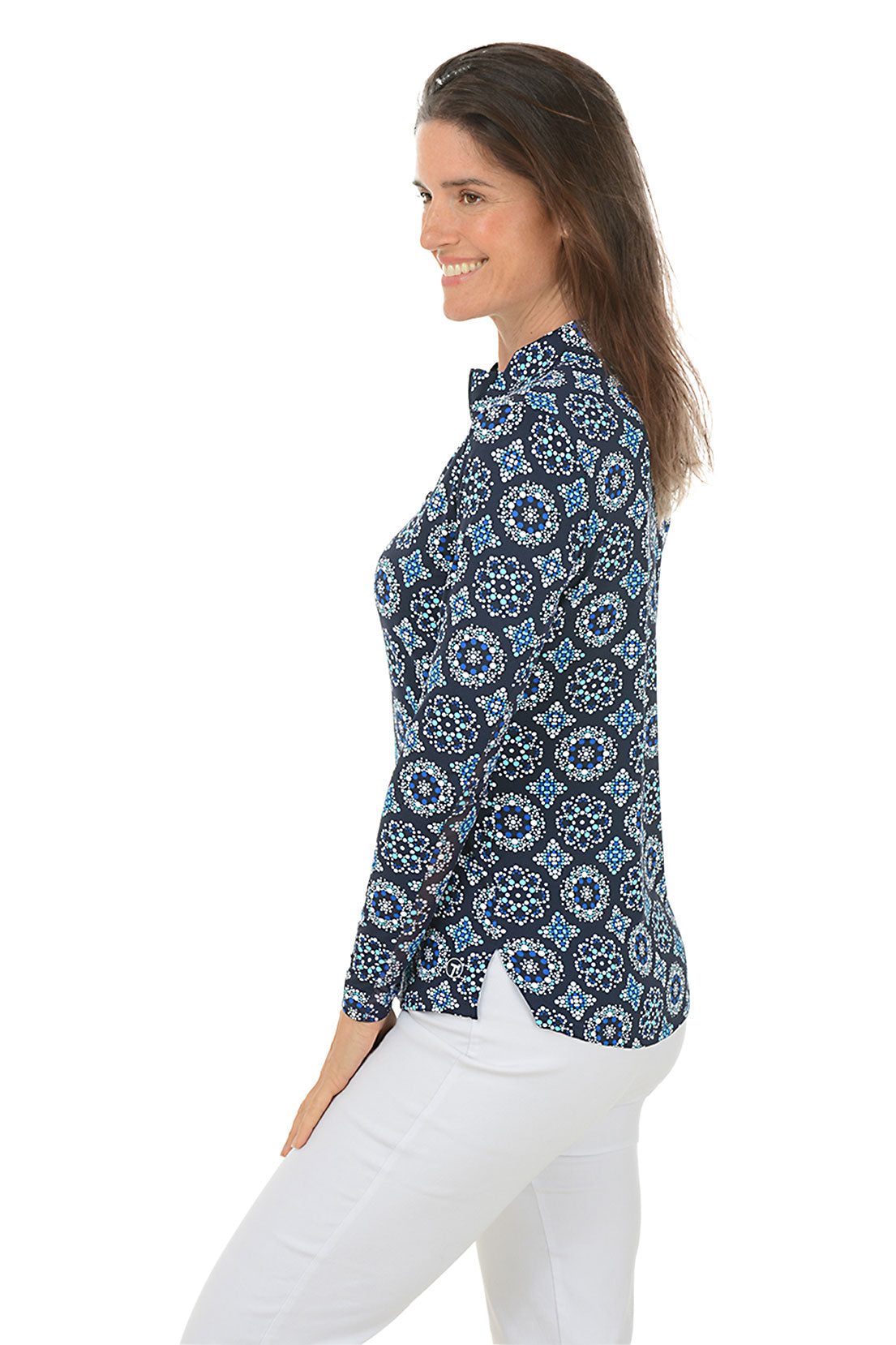 A side shot of a model wearing a mock neck, long sleeve top with a geometric pattern, in colors blue and white.