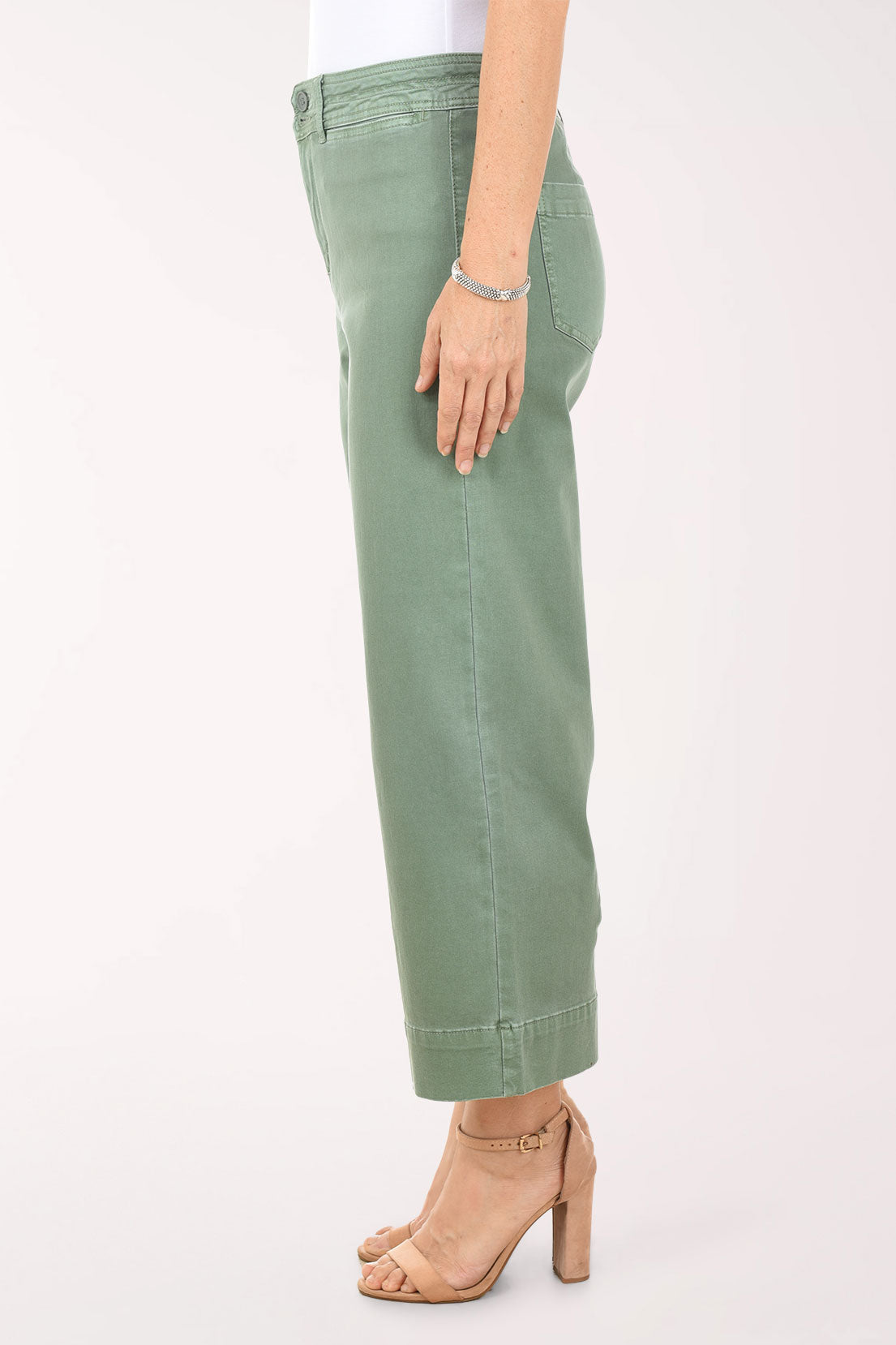 Person wearing green pants on a white background