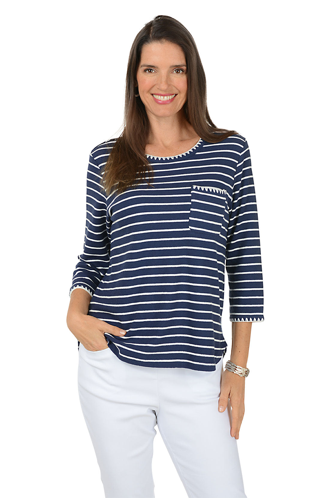 Woman wearing a navy and white striped long-sleeve shirt with a pocket on a white background