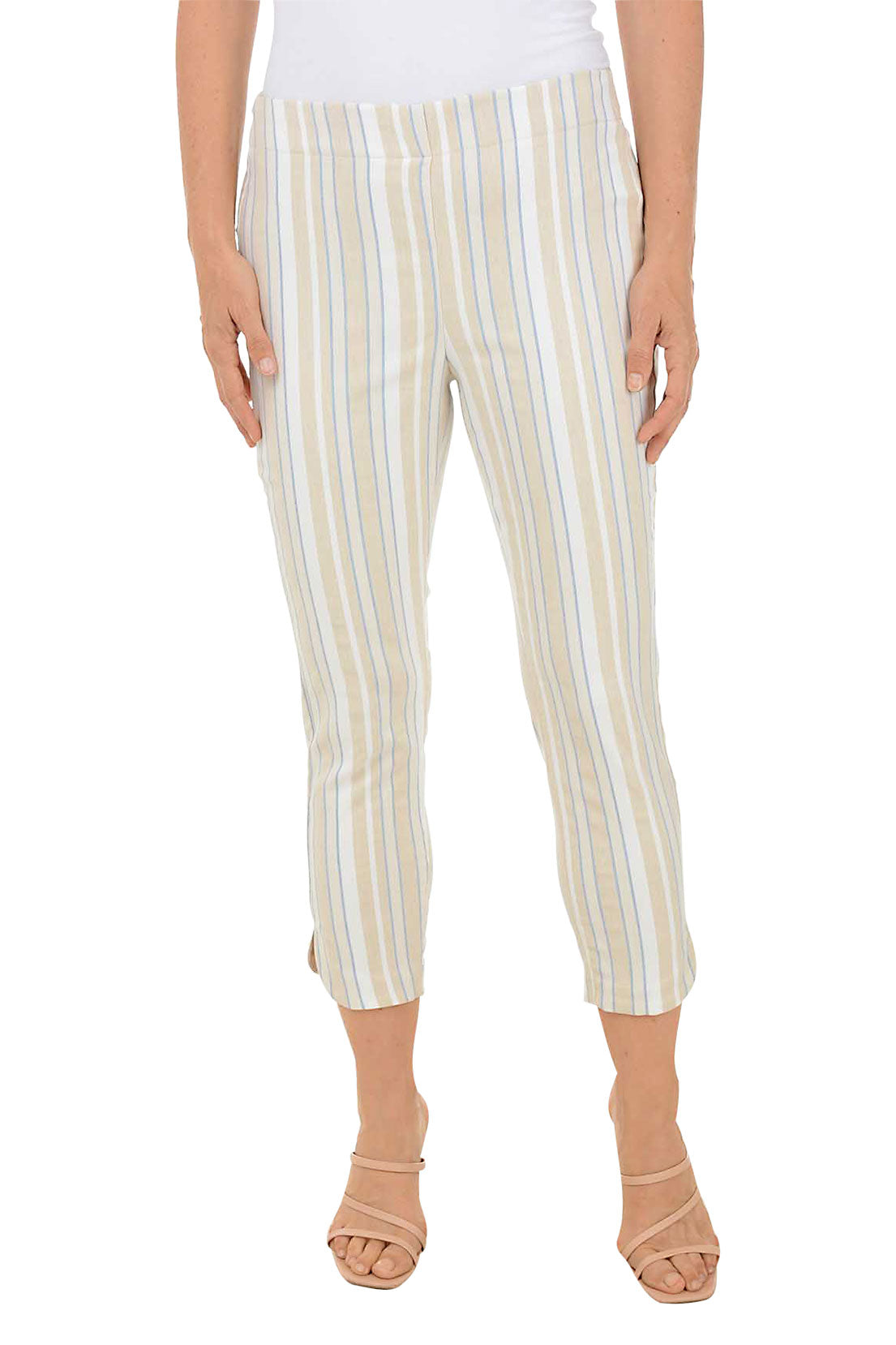 A front shot of a model wearing a pair of striped tulip hem capri pants in beige and white, with a stretch waistband and flat front design.