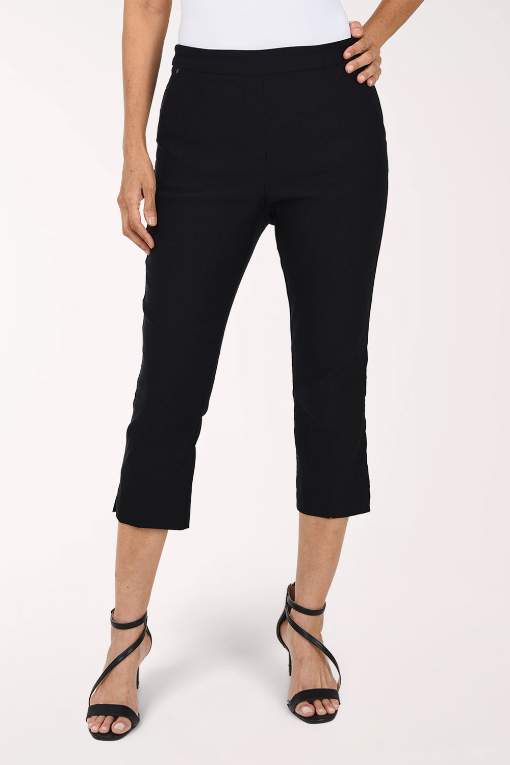 Woman wearing a black solid pull-on capri pant