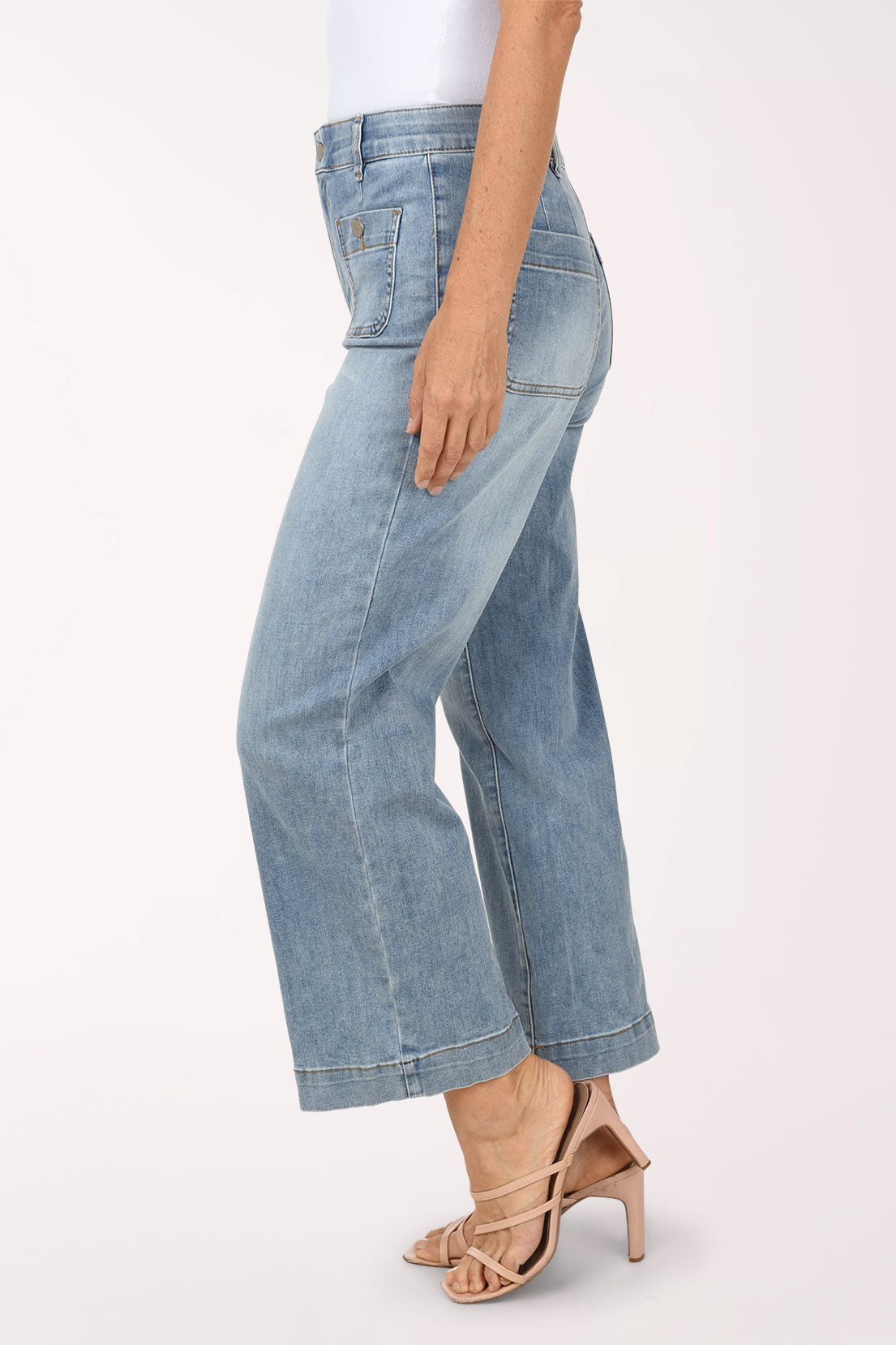 Side view of the light-wash Super Straight Patch Pocket Denim Pant showing the straight leg, front and back patch pockets, and ankle-length hem, worn with nude heeled sandals.