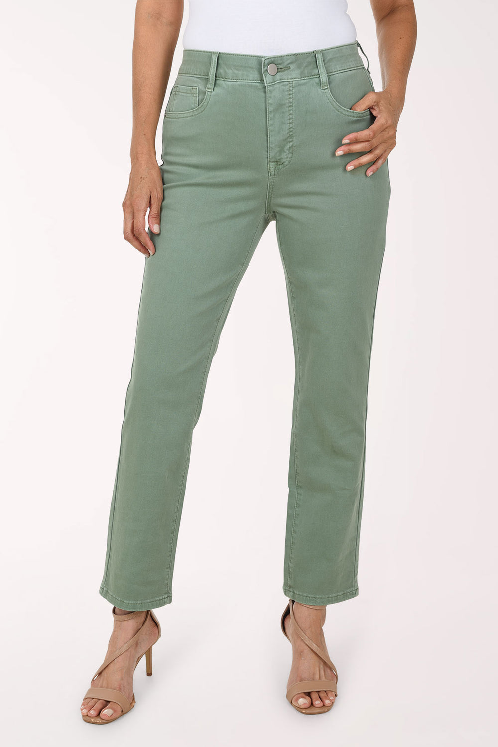 Front view of sage green Moss stretch denim straight leg ankle pants with five-pocket styling, belt loops and zip fly, worn with a white top and nude heeled sandals.