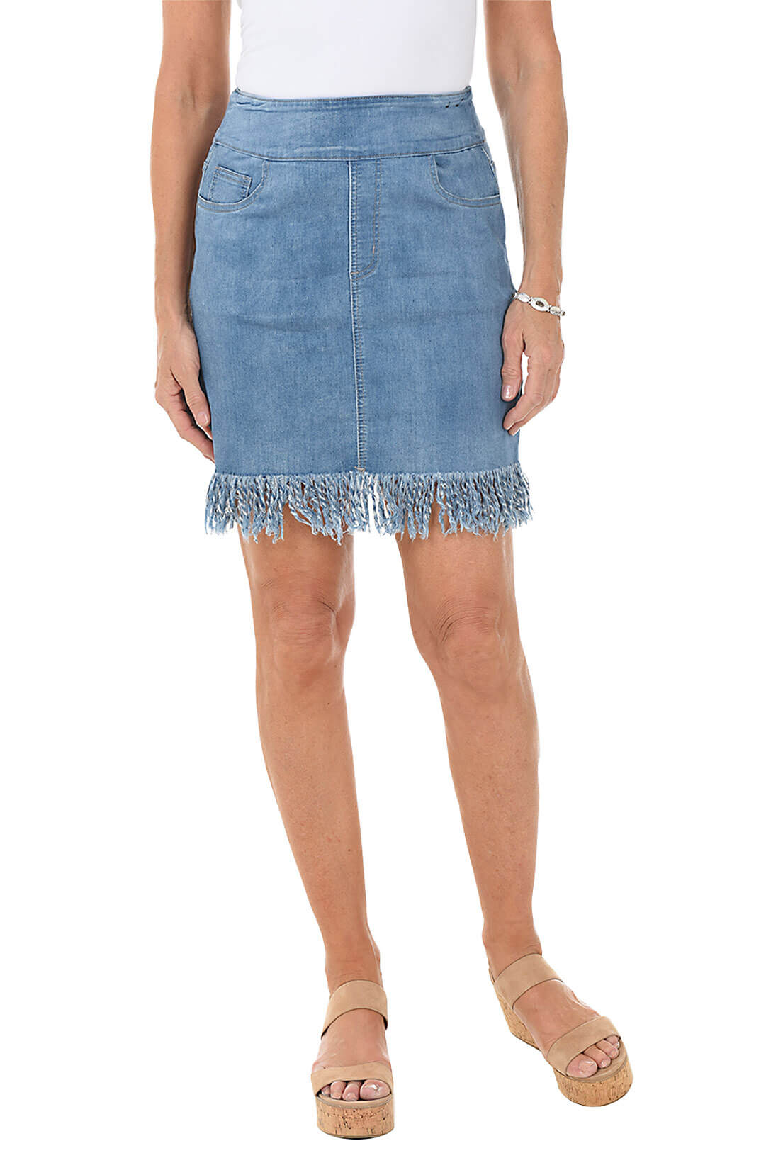 Denim skirt with fringed hem worn by a person on a white background