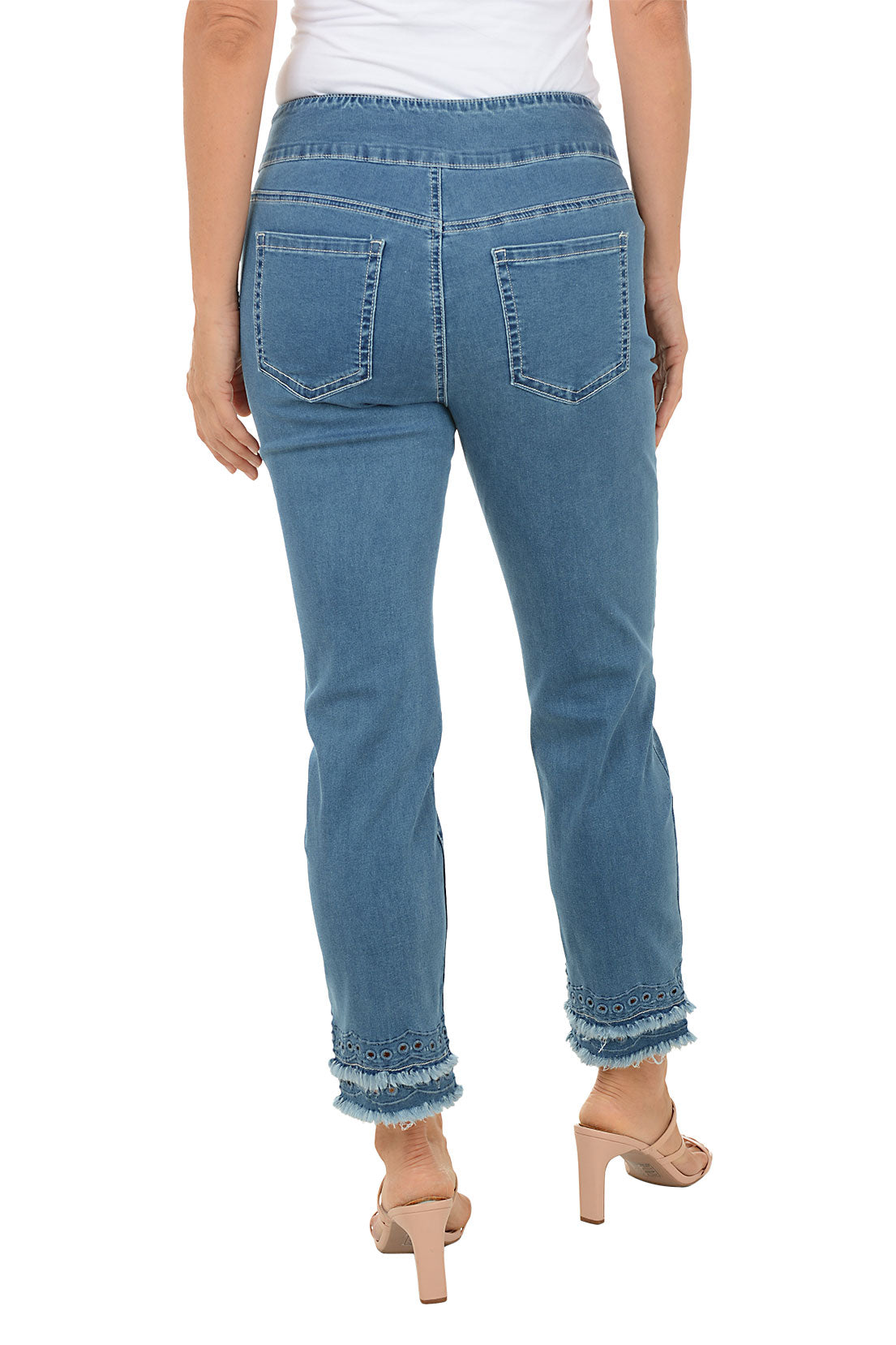 Blue jeans worn by a person on a white background. Back shot.