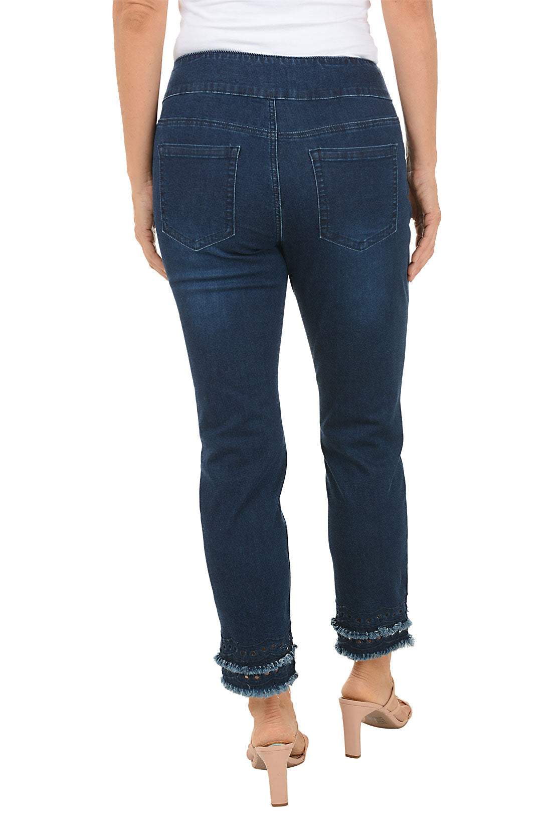 Person wearing dark blue jeans with a white background. Back shot.