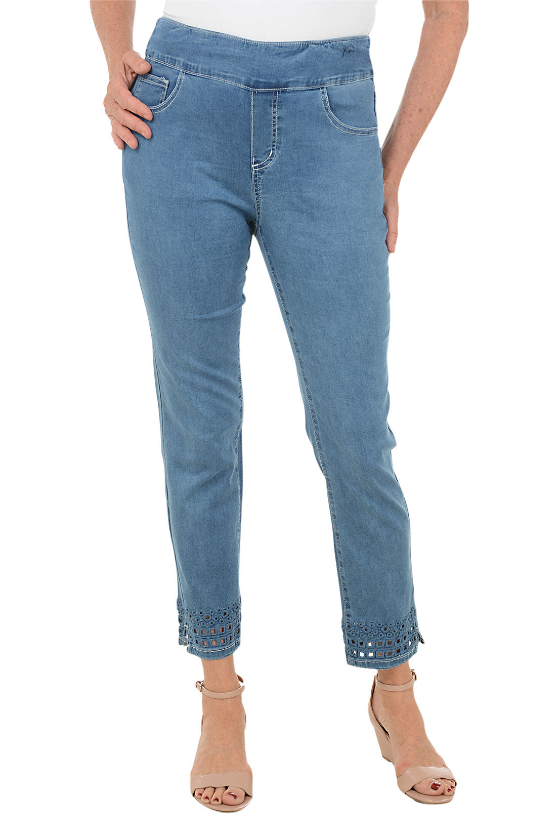 Light blue jeans worn by a person on a white background.