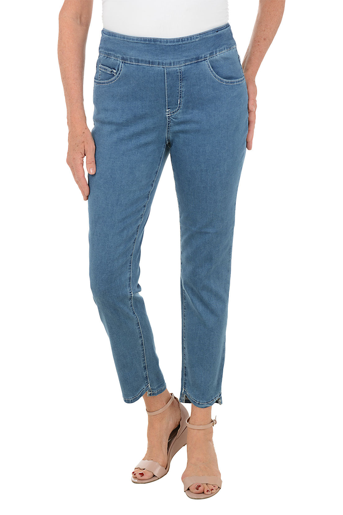 Blue jeans worn by a person on a white background.