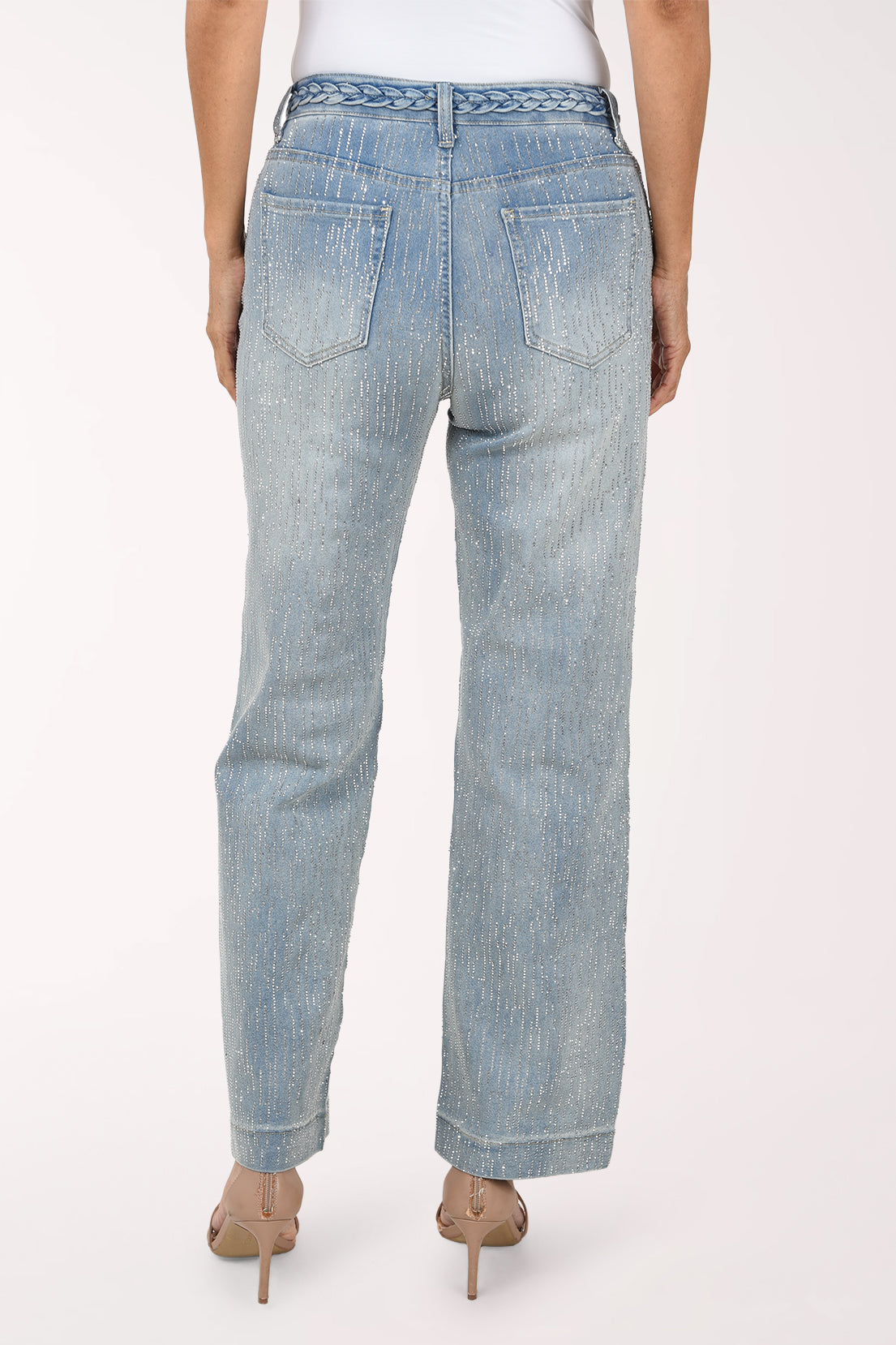 Back view of the light-wash rhinestone denim pants showing the braided waistband, back patch pockets and wide leg.