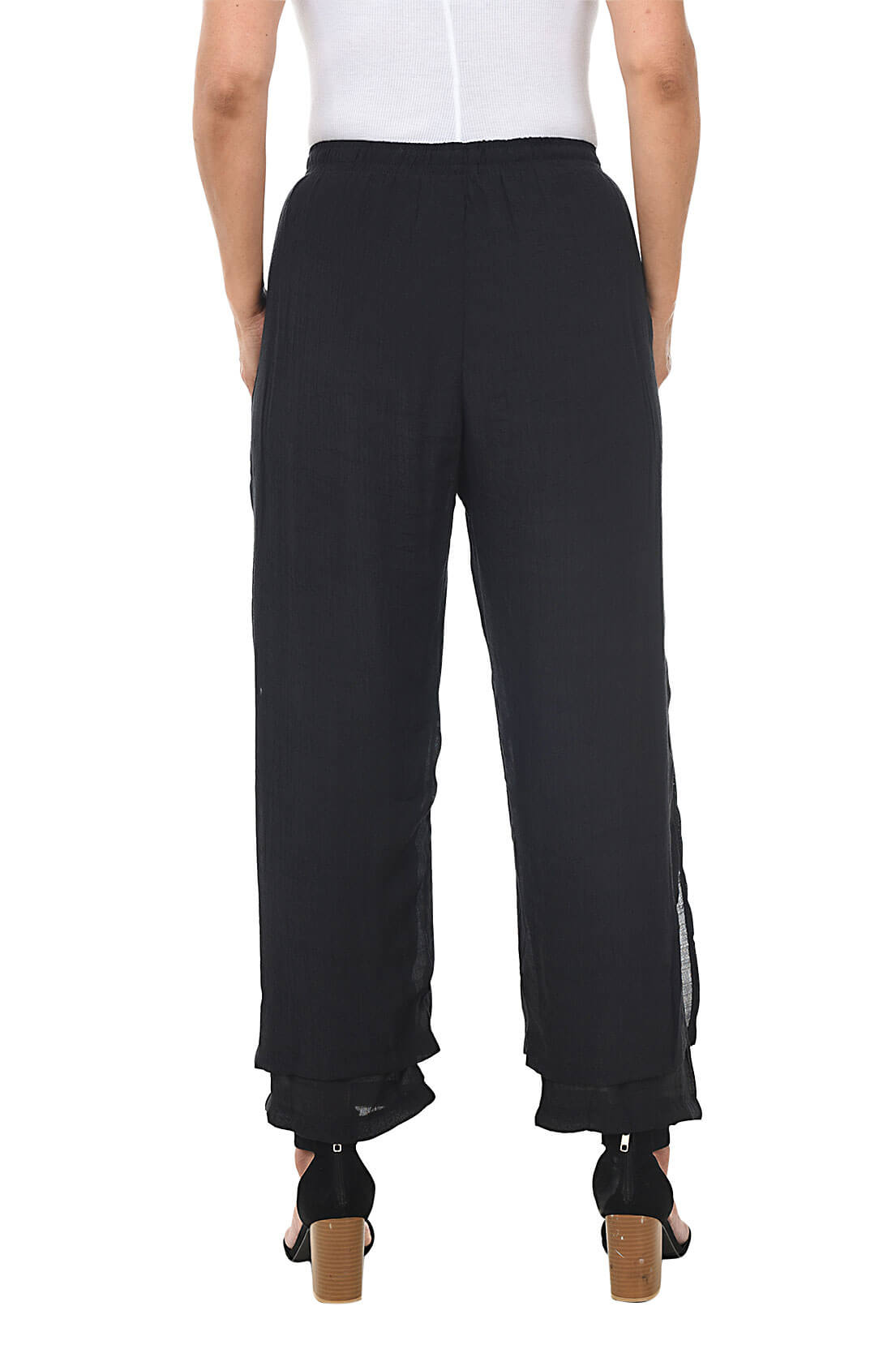 Black wide-leg pants worn by a person on a white background. Back shot.
