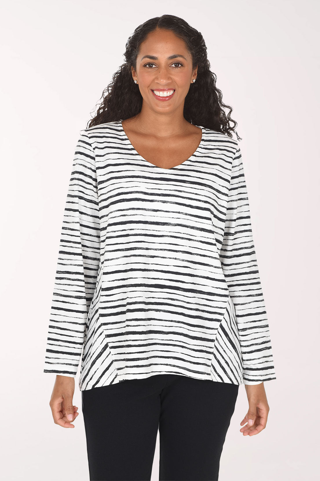Woman wearing a black and white striped long sleeve top