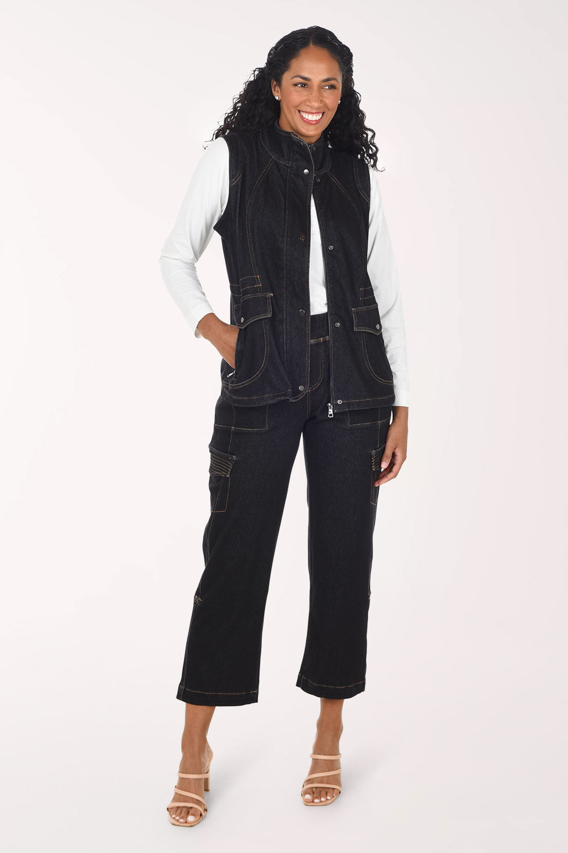 Woman wearing black denim cargo pants