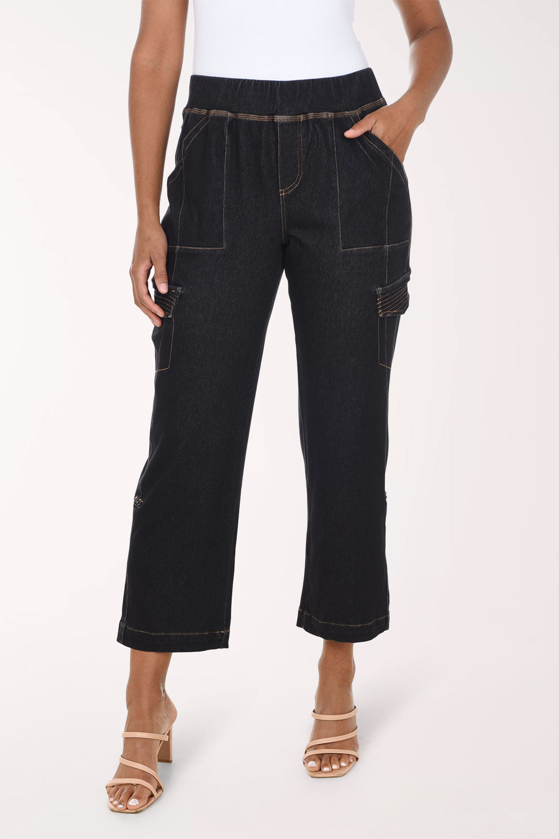 Woman wearing black denim cargo pants